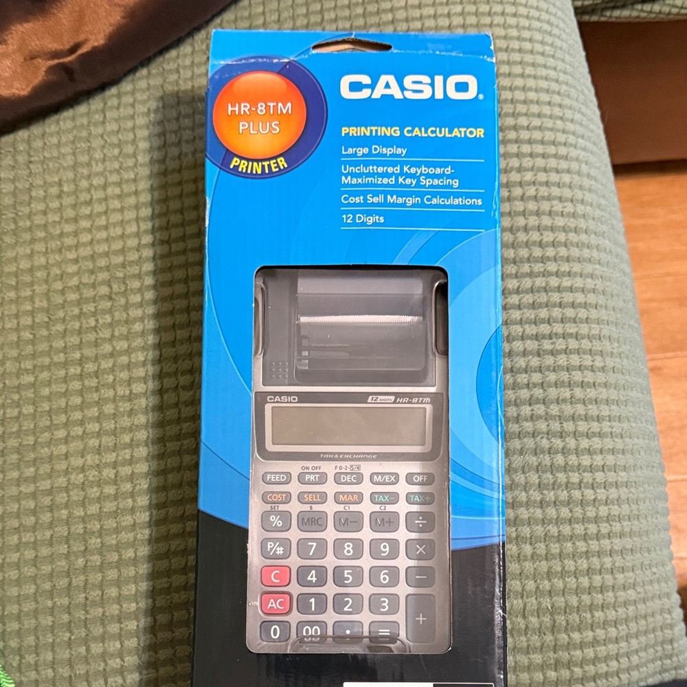 Casio Printing Calculator in Blue Packaging with Black & Gray Unit